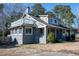 Gray house with a wrap-around porch and balcony at 507 Hawkins Ave, Sanford, NC 27330