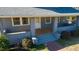 Inviting front porch with brick columns and wooden floor at 507 Hawkins Ave, Sanford, NC 27330