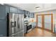 Modern kitchen features stainless steel appliances and gray cabinets at 507 Hawkins Ave, Sanford, NC 27330