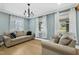 Cozy living room with hardwood floors, two sofas, and natural light at 507 Hawkins Ave, Sanford, NC 27330