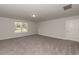 Spacious bedroom with window, carpet, and door at 55 Watermelon Dr, Franklinton, NC 27525