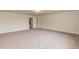 Large bedroom with carpet, door and window at 55 Watermelon Dr, Franklinton, NC 27525