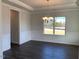 Formal dining room with hardwood floors and chandelier at 55 Watermelon Dr, Franklinton, NC 27525