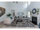 Bright living room with high ceilings and a cozy fireplace at 55 Watermelon Dr, Franklinton, NC 27525