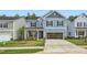 Two-story home with blue siding, two-car garage, and landscaped lawn at 1013 Aspen View Dr, Raleigh, NC 27610