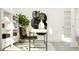 Home office with a desk, chair, built-in shelving, and large artwork at 1013 Aspen View Dr, Raleigh, NC 27610