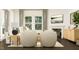 Living room featuring a fireplace, comfortable seating, and large windows at 1013 Aspen View Dr, Raleigh, NC 27610
