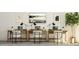 Co-working space with three desks, chairs, and modern lighting at 1013 Aspen View Dr, Raleigh, NC 27610