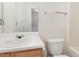 Bathroom with toilet, sink, and bathtub at 10947 Pendragon Pl, Raleigh, NC 27614