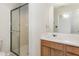 Clean bathroom with shower, sink, and wood vanity at 10947 Pendragon Pl, Raleigh, NC 27614