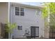 Rear view of house showcasing siding and patio at 10947 Pendragon Pl, Raleigh, NC 27614