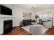 Bright living room with hardwood floors, fireplace, and comfortable seating area at 10947 Pendragon Pl, Raleigh, NC 27614