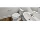 Small bathroom with a toilet and a pedestal sink at 110 Shining Amber Way, Franklinton, NC 27525