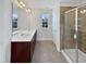 Bathroom boasts double sinks, a large mirror, and a separate shower at 110 Shining Amber Way, Franklinton, NC 27525