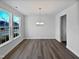 Bright dining room with hardwood floors and chandelier at 110 Shining Amber Way, Franklinton, NC 27525