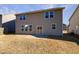 Two-story house with backyard patio and grassy yard at 110 Shining Amber Way, Franklinton, NC 27525
