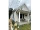 One-story home with porch, showing side yard view at 1103 E Lane St, Raleigh, NC 27601