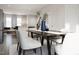 Open concept dining area with modern table and chairs at 1235 Willow Tree Way, Graham, NC 27253