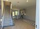 Interior view of a townhome under construction, showing stairs and kitchen at 1235 Willow Tree Way, Graham, NC 27253