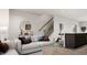 Cozy living room with light-colored sofa and round coffee table at 1235 Willow Tree Way, Graham, NC 27253