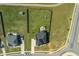 An aerial view displaying a residence with a generous backyard, firepit, and tasteful landscaping at 147 E Wellesley Dr, Clayton, NC 27520
