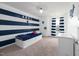 Nautical-themed bedroom with blue and white stripes and an anchor at 147 E Wellesley Dr, Clayton, NC 27520