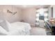 Bedroom with a large window with curtains, carpet, and dark wood dresser at 147 E Wellesley Dr, Clayton, NC 27520