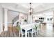 Elegant dining room with chandelier and white table at 147 E Wellesley Dr, Clayton, NC 27520