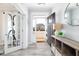 Inviting foyer with light floors and an entry door adjacent to a doorway with a glass door at 147 E Wellesley Dr, Clayton, NC 27520