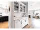 Elegant butler's pantry boasting white cabinetry and countertop space with seamless connection to the kitchen and living area at 147 E Wellesley Dr, Clayton, NC 27520
