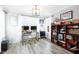Bright home office with desk, shelving, and natural light at 147 E Wellesley Dr, Clayton, NC 27520