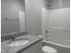 Bathroom with single vanity, granite countertop and bathtub at 19 Shiloh Dr, Lillington, NC 27546