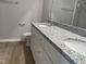 Double vanity bathroom with granite countertop and white cabinets at 19 Shiloh Dr, Lillington, NC 27546