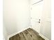 Neutral painted door with new trim and gray floors in a modern, updated home at 203 Lake Edge Dr, Lillington, NC 27546