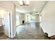 Open living room boasts sleek hard surface floors, a cozy fireplace, neutral walls and plenty of natural light at 203 Lake Edge Dr, Lillington, NC 27546