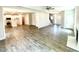 Spacious open concept with modern flooring, fireplace, and ample natural light flowing into the kitchen at 203 Lake Edge Dr, Lillington, NC 27546