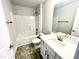 Clean bathroom featuring a vanity and shower-tub combination at 217 Lake Edge Dr, Lillington, NC 27546