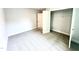 Spacious bedroom featuring plush gray carpeting and a convenient walk-in closet at 217 Lake Edge Dr, Lillington, NC 27546