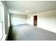 Open floor plan with lots of natural light and gray carpeting at 217 Lake Edge Dr, Lillington, NC 27546