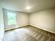 Bedroom featuring a single window and neutral carpeting at 217 Lake Edge Dr, Lillington, NC 27546