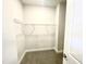 Walk-in closet featuring neutral paint and shelving at 217 Lake Edge Dr, Lillington, NC 27546