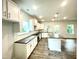Modern kitchen featuring white cabinets, dark countertops, stainless steel appliances, and hardwood floors at 217 Lake Edge Dr, Lillington, NC 27546