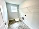 Dedicated laundry room area featuring vinyl flooring at 217 Lake Edge Dr, Lillington, NC 27546