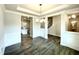 Open living room with hardwood floors, staircase, and views to the kitchen and dining room at 217 Lake Edge Dr, Lillington, NC 27546