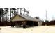 Community picnic shelter with picnic tables and trash cans at 217 Lake Edge Dr, Lillington, NC 27546