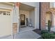 Townhome front entry with black door and welcoming decor at 2209 Sweet Annie Way, Wake Forest, NC 27587