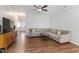 Spacious living room with L-shaped sofa and wood floors at 2209 Sweet Annie Way, Wake Forest, NC 27587