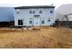 Backyard view with patio, grass, and a wooden fence at 302 Glenview Ln, Durham, NC 27703