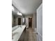 Bathroom boasts double sinks, a bathtub, and access to another room at 302 Glenview Ln, Durham, NC 27703
