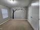 Bedroom with gray walls, carpet flooring, and tree wall art at 302 Glenview Ln, Durham, NC 27703
